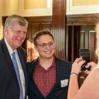 Haas with guest take picture